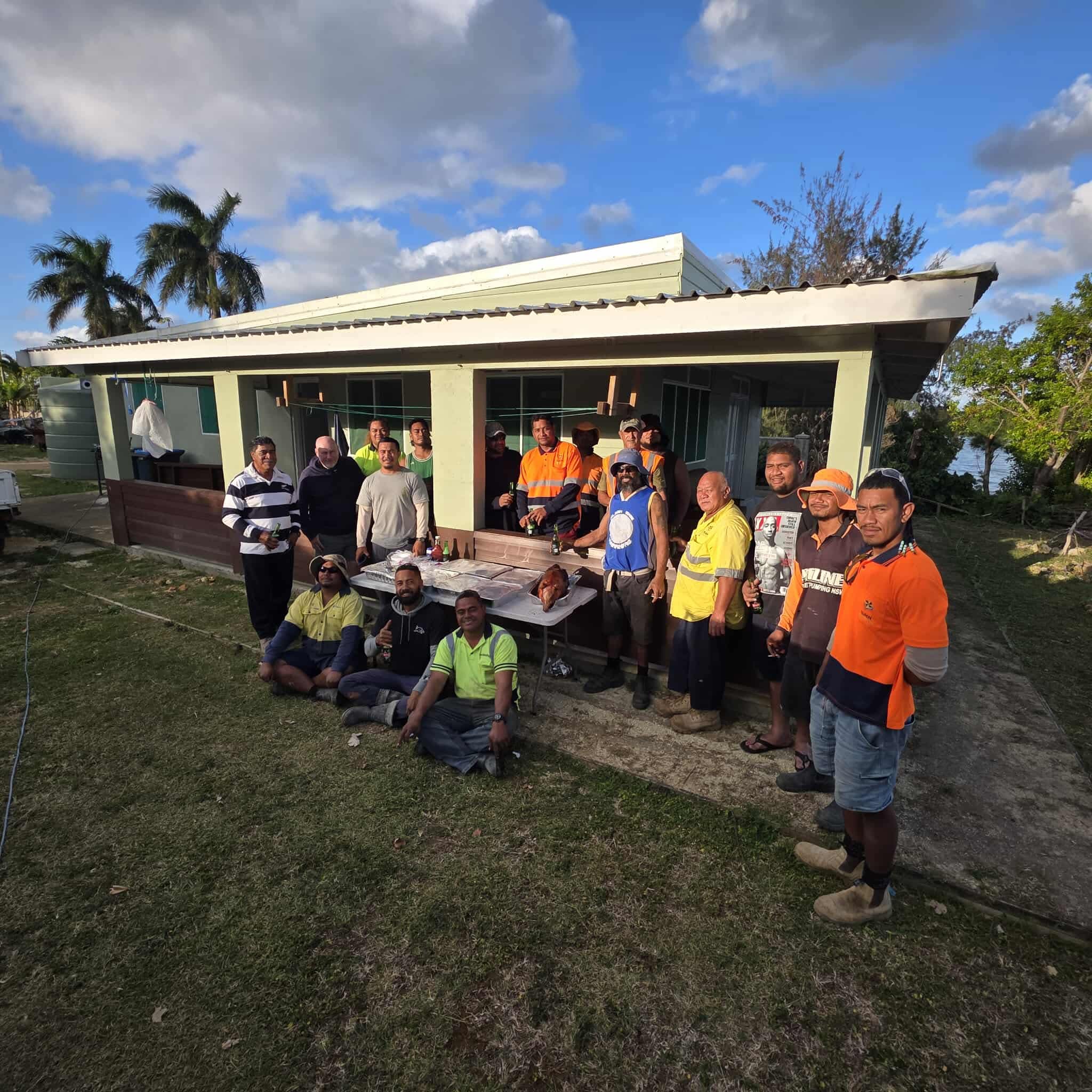 Build N Concrete Ltd construction team standing outside a completed residential construction project in the Pacific region.